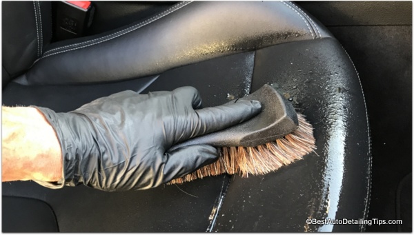 cleaning black coated car leather
