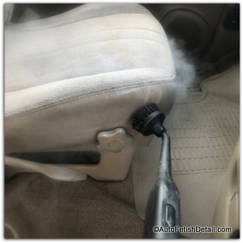 Detailing car with car steam cleaner