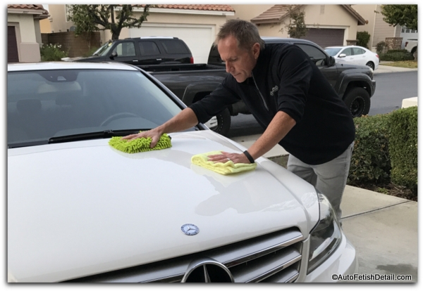dry car care on white mercedes benz
