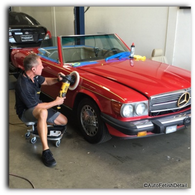 polishing a car with a rotary polisher