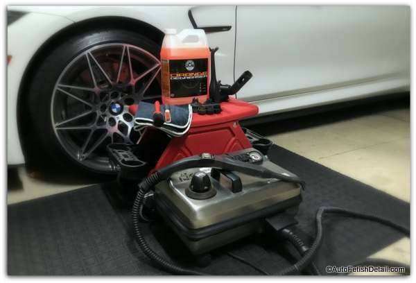 Cleaning Of Car Salon With Steam Cleaner. Side View Of