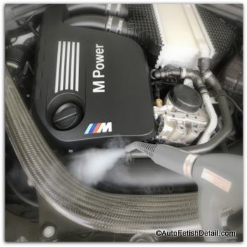 Using car steam cleaner to steam clean car engine